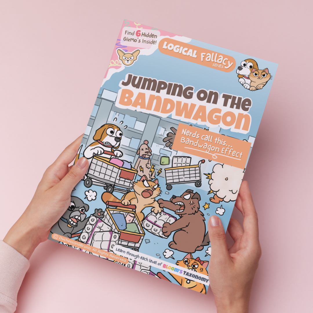 Hand holding a printed copy of the Bandwagon Effect logical fallacy activity pack showing the cover and print quality