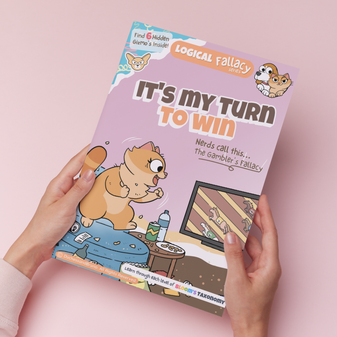 Hand holding a printed copy of the Gambler's fallacy activity pack showing the cover and print quality
